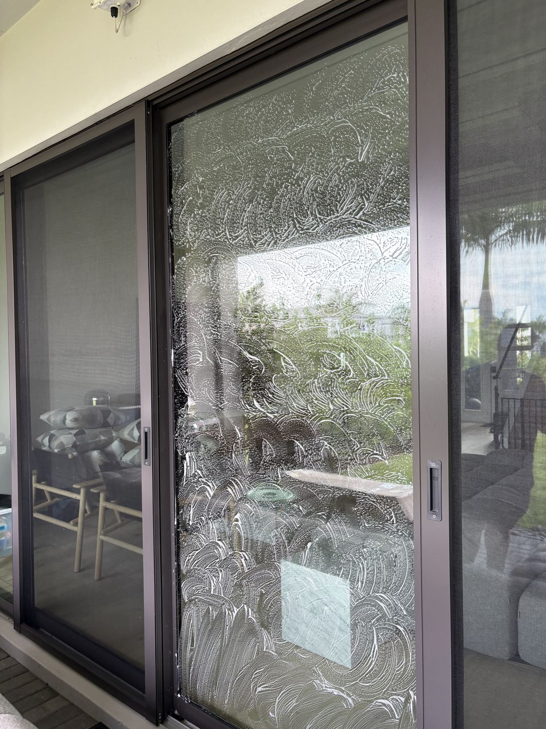 Sliding door mid-clean covered in foam